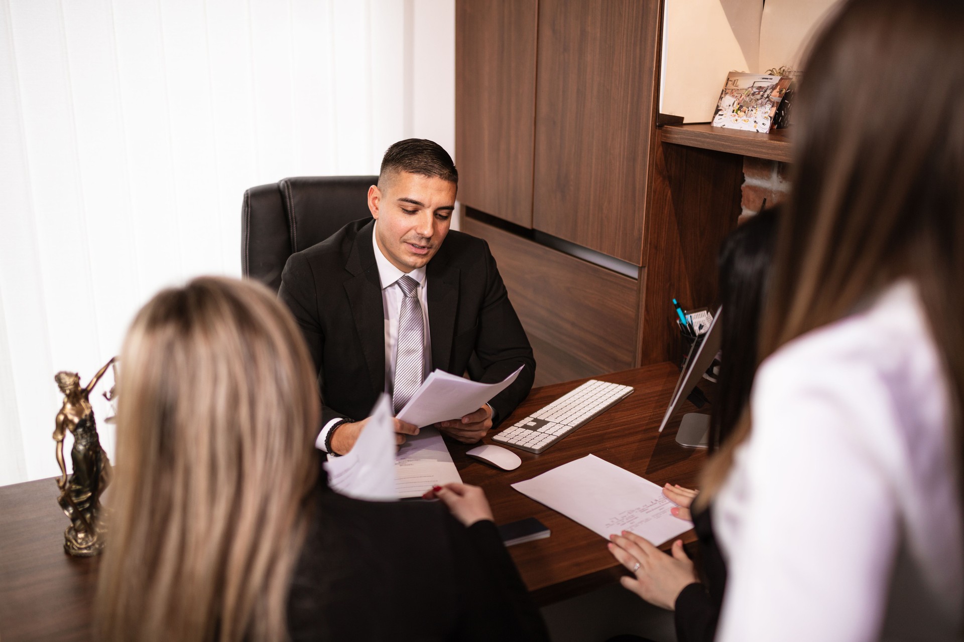 Lawyer discussing with client at office